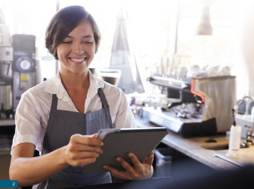 woman reading from tablet taking orders