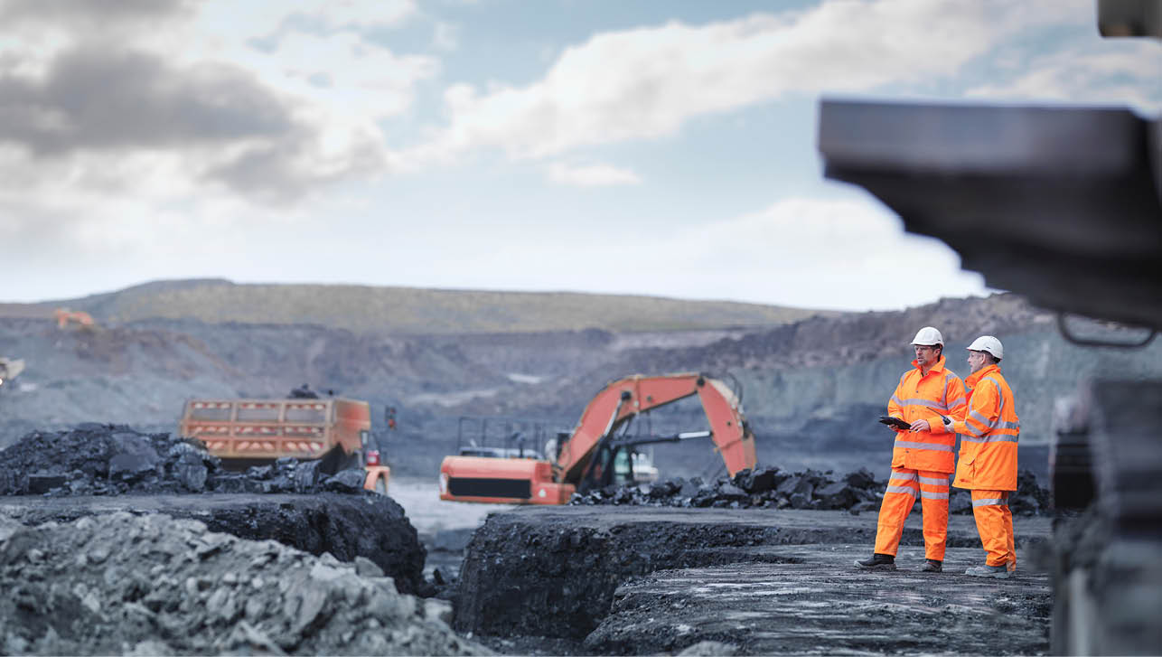 Miners in discussion in surface coal mine  Image downloaded by   at 22:04 on the 13 06 15