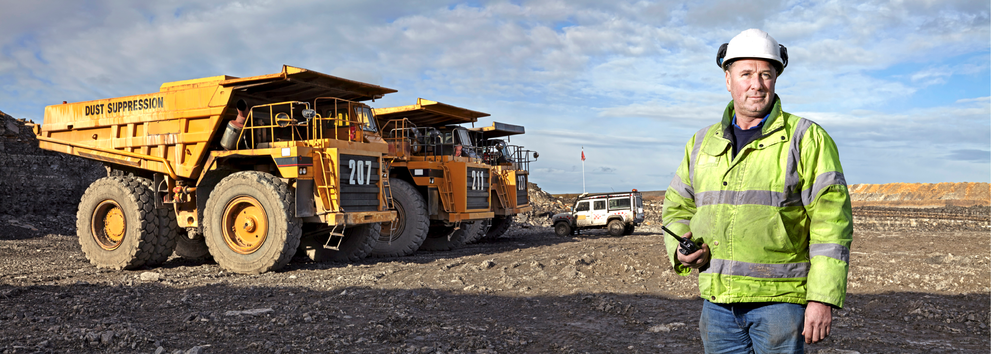 Portrait of foreman with walkie talkie working at quarry